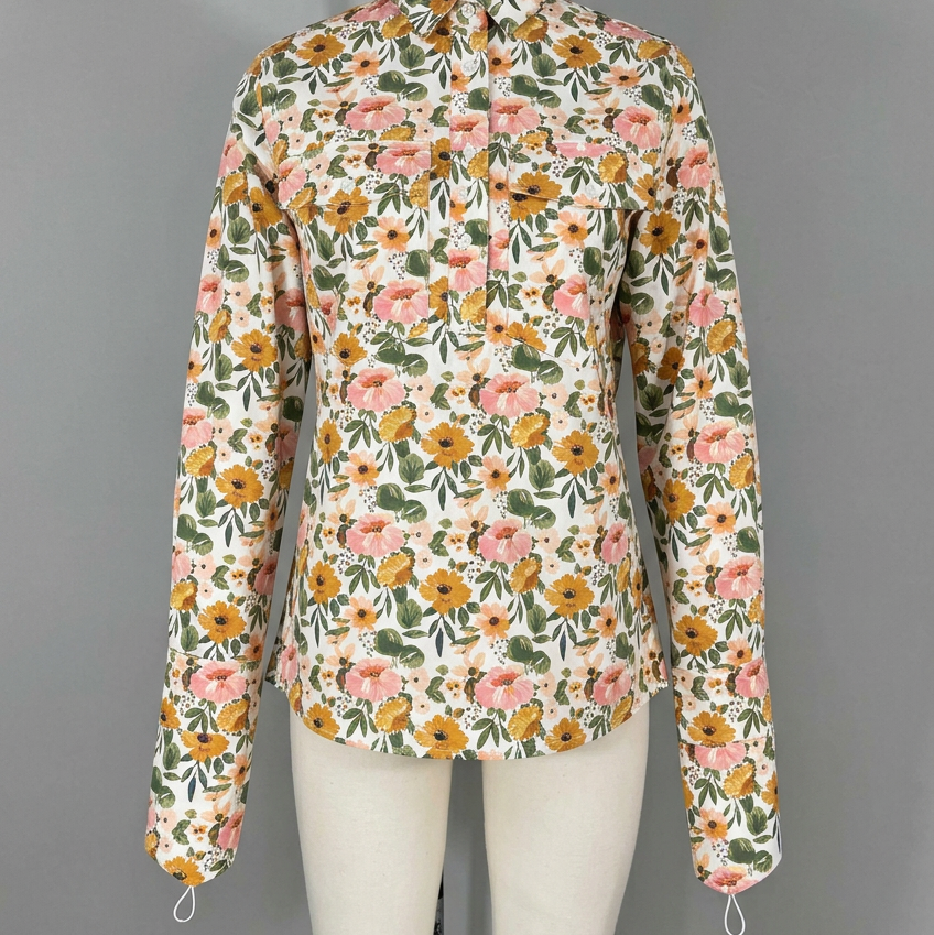AI-cleaned front reference view of the floral half-button shirt with attached handpieces
